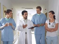 HD: Senior Doctor Mentoring Young Interns Stock Footage