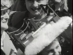 A woman wears a model of the Brooklyn Bridge on her Easter bonnet. News Clip