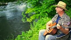 Man playing acoustic guitar Stock Footage