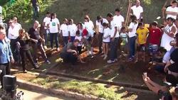 Harry works up a sweat planting trees in rainforest, playing football with kids News Clip
