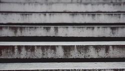 woman's feet coming down the stairs Stock Footage