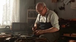 HD DOLLY: Shoemaker Lasting A Shoe Stock Footage