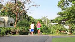 People jogging in public park Stock Footage