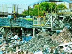MS T/L ZI trash sorting machines and conveyer belts spewing out sorted and ground-up trash Stock Footage