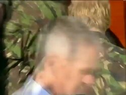 2007 MS Soldiers walking Prince Harry to truck during his visit to Royal Navy Bomb Disposal Unit / CU ZO Harry sitting in truck as fellow soldier shows equipment on Hornsea Island on October 31, 2007 / Portsmouth, England / AUDIO Stock Footage