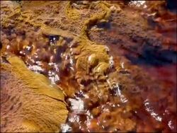 Water stained red by mineral ores (iron & other minerals at very high pH), Rio Tinto, Huelva, Andalusia, Spain Stock Footage