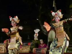 MS Balinese girl dancers performing Legong Dance in front of Gamelan orchestra in Puri Saraswati temple AUDIO / Ubud, Bali, Indonesia Stock Footage