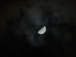 Moon closeup with clouds 1 Stock Footage
