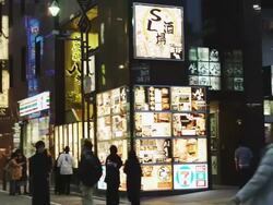 WS PAN People walking row of restaurant near Shinbashi station / Tokyo, Tokyo-To, Japan Stock Footage