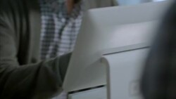 Smiling customer signs name on square tablet at checkout counter in local shop Stock Footage