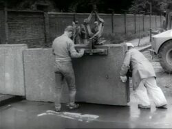 Berlin Wall starts to be built, guard defects Stock Footage