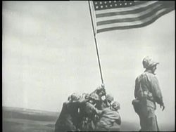 Soldiers raise an American Flag at Iwo Jima. News Clip