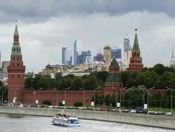 WS T/L View of Kremlin with passenger ferry boat moving in river / Moscow, Russia  Stock Footage