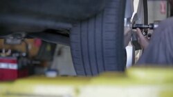 Flat Tire Repair and Car Maintenance at Garage Stock Footage