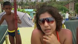 People flock to the beach to forget protests and enjoy the carnival; small anti-govt protest News Clip