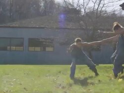 two women running fast as camera pans with them, they dance at end Stock Footage