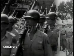 1948: KOREA INDEPENDENCE: MS Gen. Douglas MacArthur (1880-1964) standing, watching. MS Korean soldiers marching in parade. VS Korean soldiers performing rifle drills. VS Korean soldiers taking rifles apart, working on artillery piece, handling bazooka Instructional Video