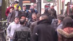People walking through rain in Amsterdam News Clip