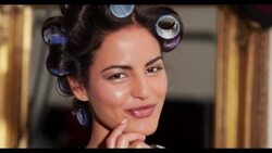 A woman with her hair in rollers Stock Footage