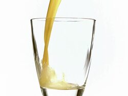 MS SLO MO Orange Juice being poured into glass / Vieux Pont, Normandy,  France Stock Footage