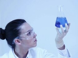 Science. Female lab worker and glass flask. Stock Footage