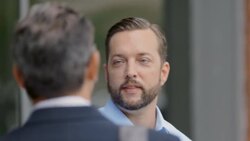 Restaurant owner meets financial advisor outside of business Stock Footage