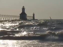 Lighthouse, Sailboat and Waves Stock Footage