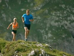 HD Super Slow-Mo: Athletes Running On A Mountain Trail Stock Footage