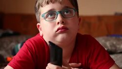 Little boy watching TV Stock Footage