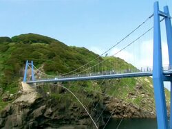 MS Shot of Gwanumgyo bridge with people at coast of gwanumdo island(one of wonderful sight in Uleungdo island ) / Uleung, Gyeongsangbuk-do, South Korea Stock Footage