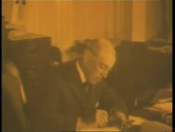 U.S. President Woodrow Wilson signs a document declaring war. News Clip