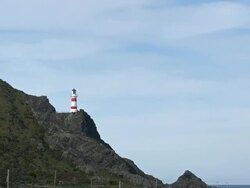 Clouds move past lighthouse Stock Footage