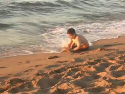 Child Playing Game at the Beach Stock Footage