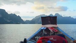 backpack bag on boat in Cheow Lan lake, Thailand Stock Footage