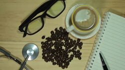 Wood desk and office supplies with coffee. Stock Footage