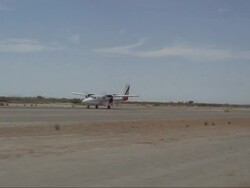 A skydiving plane powers up and takes off the runway. Stock Footage