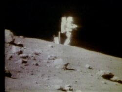 wide shot of astronaut standing on Moon Stock Footage
