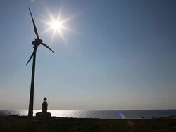 HD: Lighthouse and Wind Turbine Stock Footage