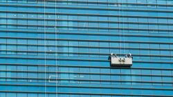 Workers washing windows in the office building. Stock Footage