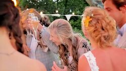 Bride and groom dancing and drinking champagne at reception Stock Footage
