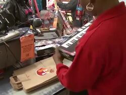Family Dollar cashier scans packages, packs them, exterior of store Stock Footage