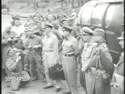 1951: KOREAN WAR: U.S. VICE ADMIRAL CHARLES TURNER JOY: ** VS United States Vice Admiral C. Turner Joy (1895-1956) walking w/ other officers, press photographers around, Joy boarding helicopter, taking off. Ceasefire, truce, peace talk Instructional Video