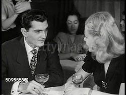 1946: MEXICO CITY NIGHT LIFE: DRAMATIZATION: INT VS Man & woman talking at dinner table '...senorita please... I am an American by geography but a Mexican by nationality & very very proud of it...' Flirting Instructional Video