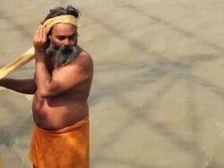 Sage in river ganges, Rishikesh, Uttarakhand, India Stock Footage