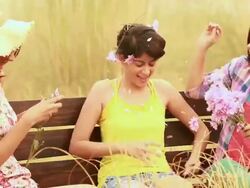Three young women playing with flowers in the forest, Delhi, India Stock Footage