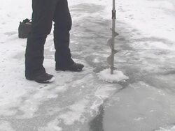Drilling a Hole in Ice Stock Footage