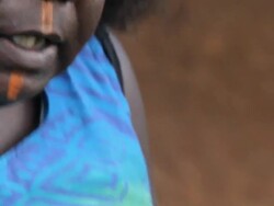 CU ZO TU TD Woman applying traditional paint to her face on tiwi islands / Northern Territory, Australia Stock Footage