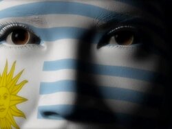 Beautiful girl Uruguay flag face painted Stock Footage