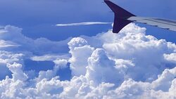Flying With Airplane Over Cumulus Clouds Stock Footage