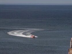 SPEED BOAT APPROACHES WEST PIER Stock Footage